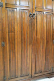 Vintage English Tiger Oak Cathedral Carved Linen Fold Double Door Wardrobe