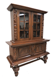 Vintage French Carved Bruegel Style Two Piece China Cabinet With Acorn Feet